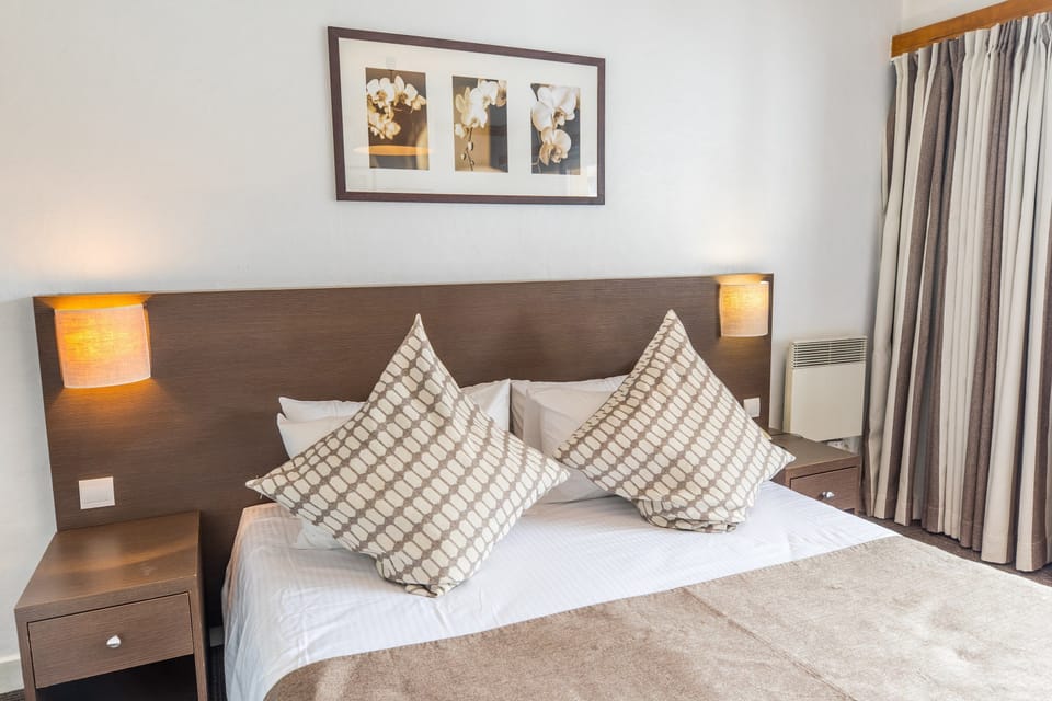 Relax on the luxurious bed after a day outside.