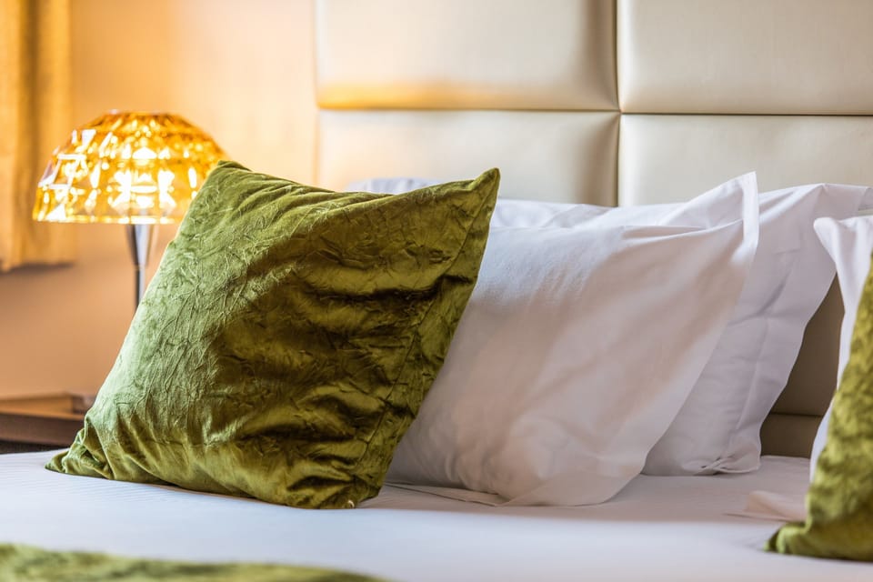 Relax on the luxurious bed after a day outside.