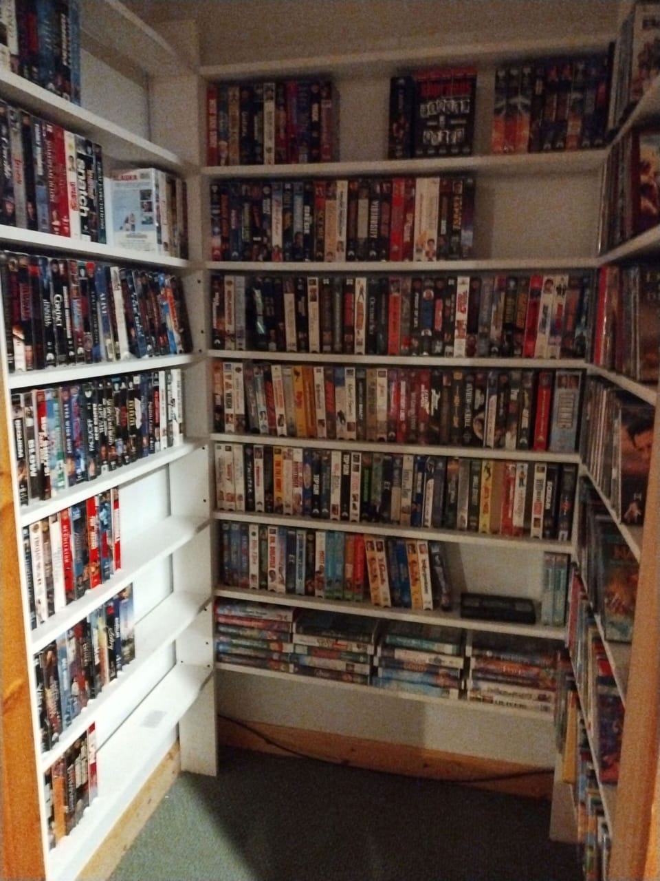 closet of VHS and DVD video library, lower level near pool table