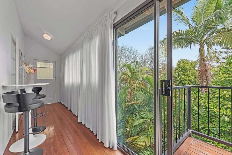 Sunroom opens to side balcony with City views...