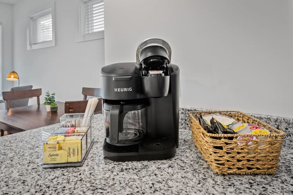 A well‑appointed, fully equipped kitchen with everything you need for home‑cooked meals — fridge, freezer, microwave, stove, oven, toaster, blender, spices, and more. Enjoy the coffee station with a drip pot + Keurig combo and ample counterspace.