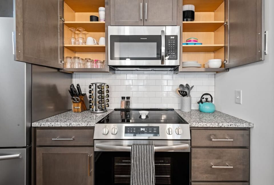 A well‑appointed, fully equipped kitchen with everything you need for home‑cooked meals — fridge, freezer, microwave, stove, oven, toaster, blender, spices, and more. Enjoy the coffee station with a drip pot + Keurig combo and ample counterspace.