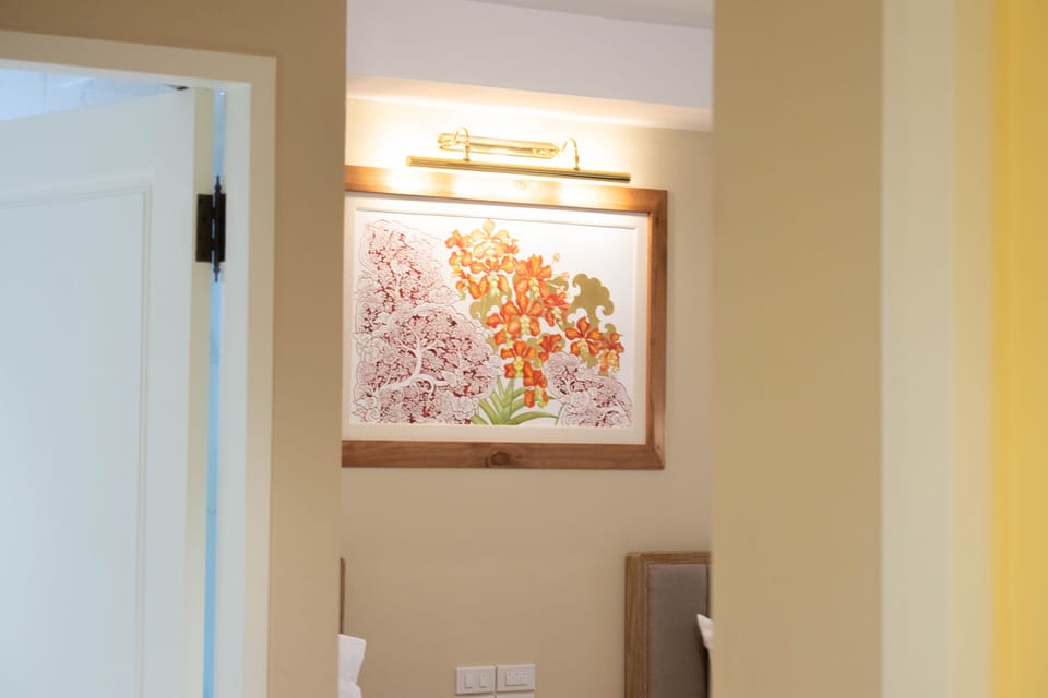 Deluxe Twin Room | Minibar, in-room safe, individually decorated, desk