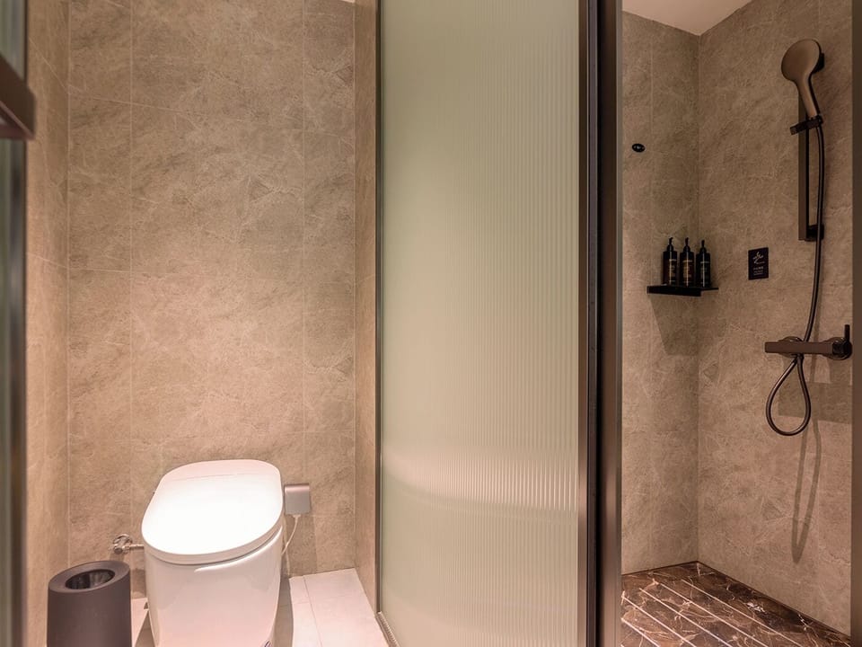 Shower, rainfall showerhead, designer toiletries, hair dryer