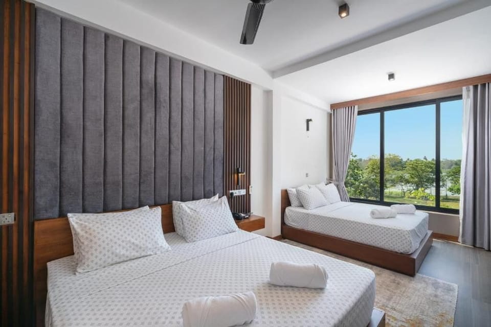Deluxe Quadruple Room | Premium bedding, in-room safe, individually furnished, desk