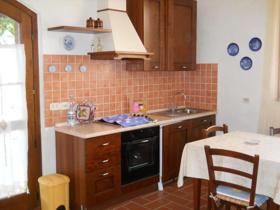 Apartment | Private kitchen | Full-size fridge, oven, stovetop, highchair