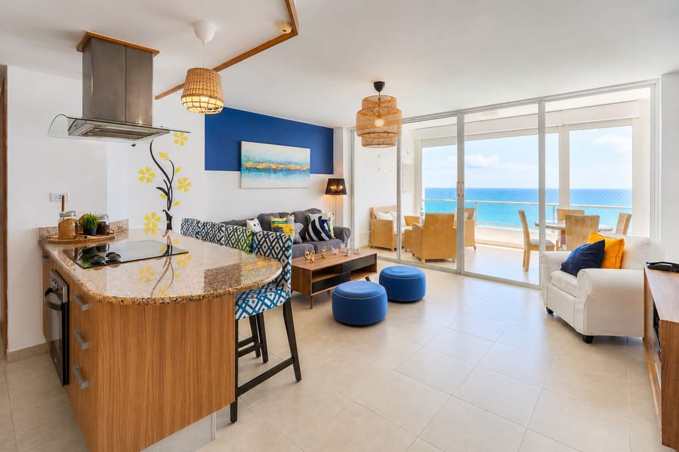 Living Room: Spectacular ocean views await in this airy space with chic decor and inviting seating!