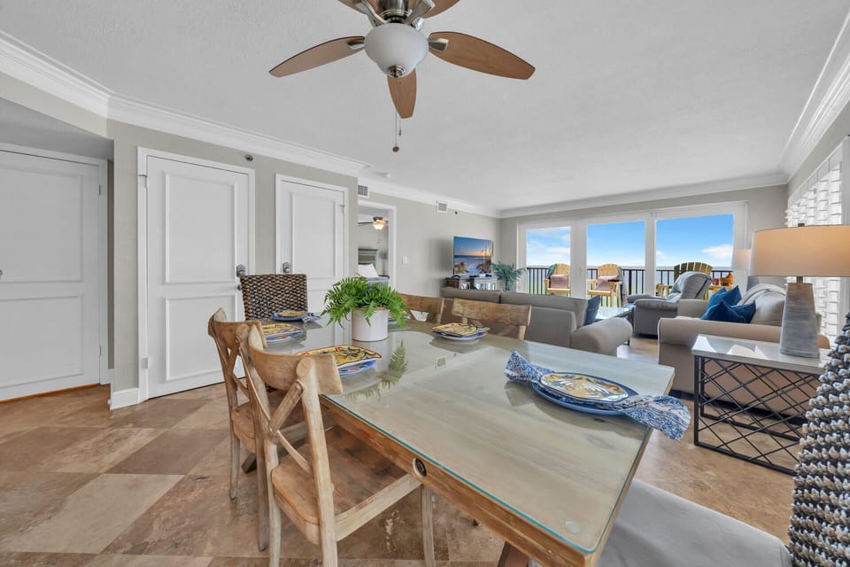 Your bright dining space flows seamlessly to the living area, where ocean breezes from your private balcony keep you comfortable.
