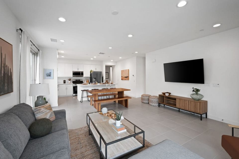 Bright open living area flowing into kitchen & dining w/ modern finishes