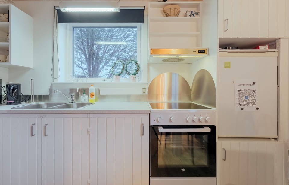 Studio, 1 Large Twin Bed | Private kitchen | Coffee/tea maker, full-size fridge, microwave, oven