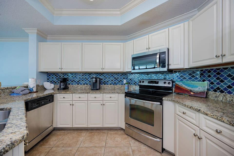 Create your favorite meals in this charming kitchen, surrounded by vibrant decor that enhances your beach experience