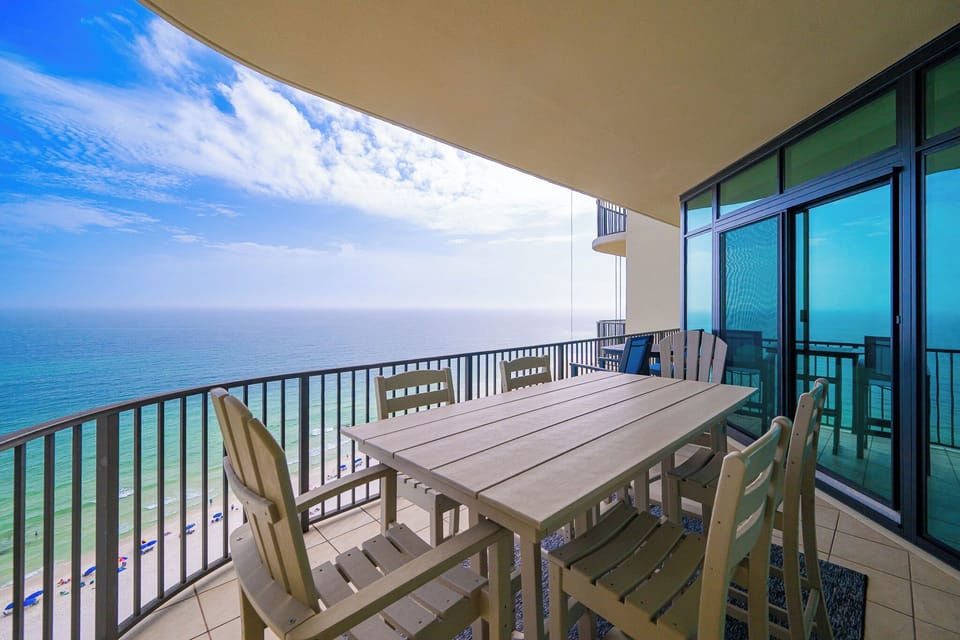 Relax at your balcony table, savoring the coastal views while creating lasting family memories in this inviting space
