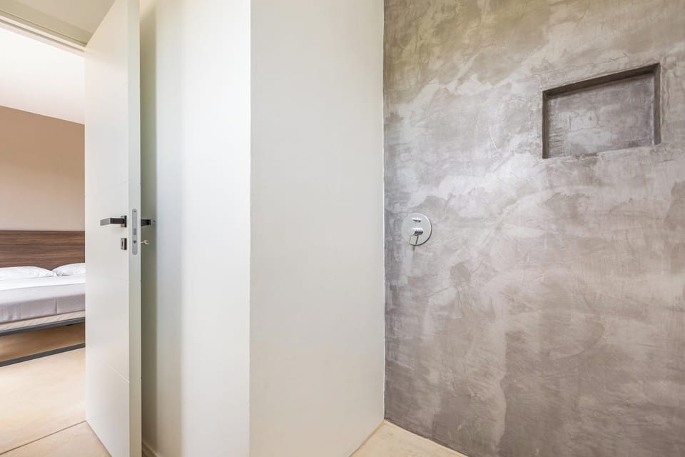 Villa | Bathroom | Shower, rainfall showerhead, towels