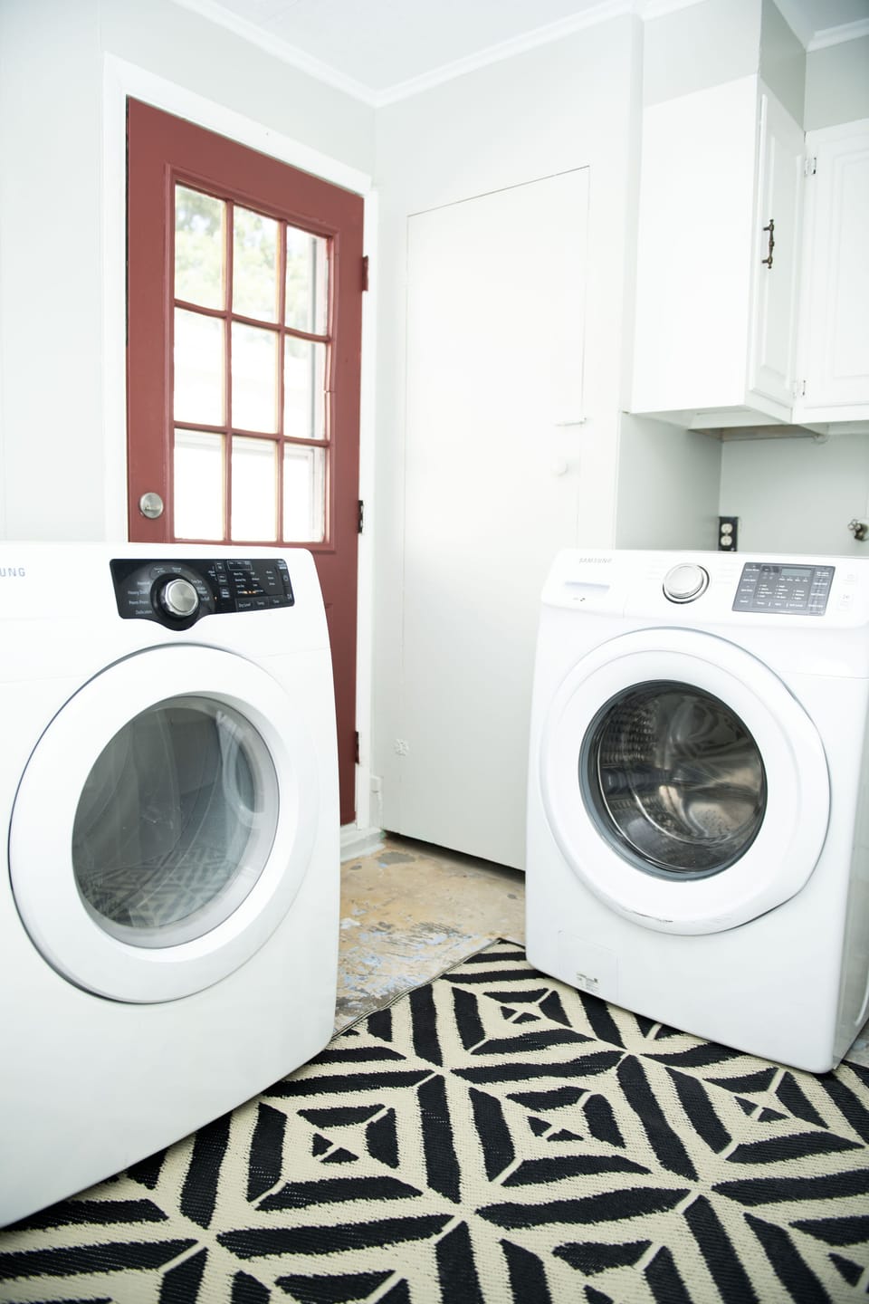 Laundry room with washing machine and dryer