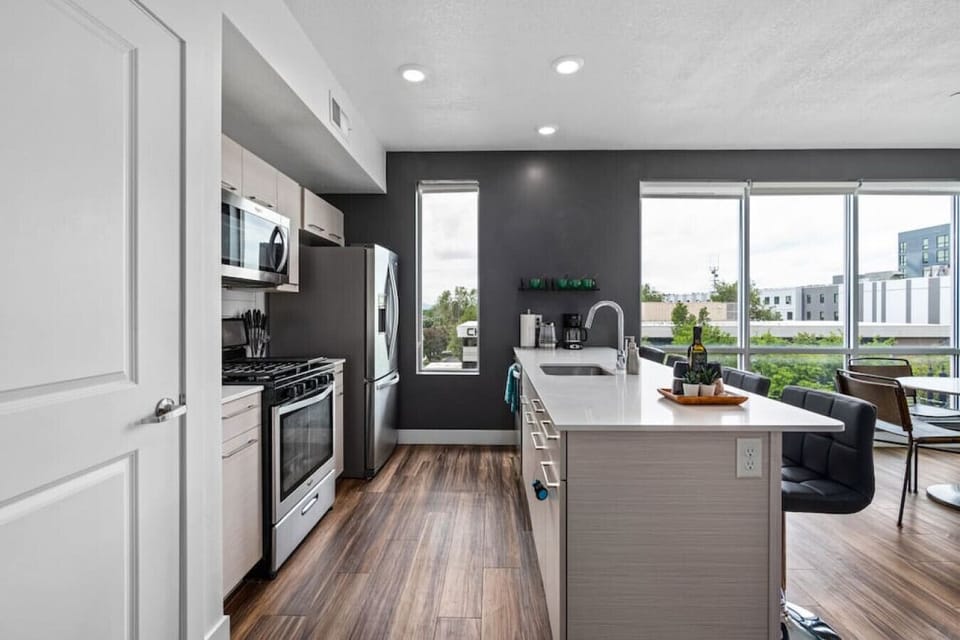 Open plan kitchen/living room with ceiling to floor windows and  amazing views