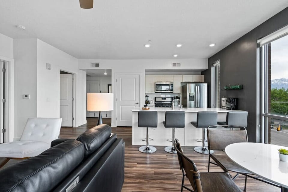 Open plan kitchen/living room with ceiling to floor windows and  amazing views