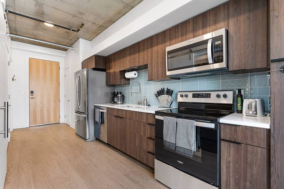 Real This kitchen is ready for any cooking adventure with pots, pans, bakeware, salt +pepper, and olive oil., visual and physical, is vital to every room
