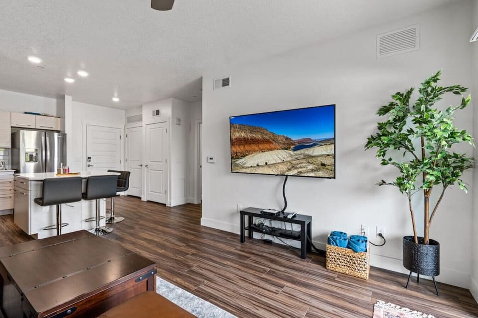 Open plan kitchen/living room. 65` TV.