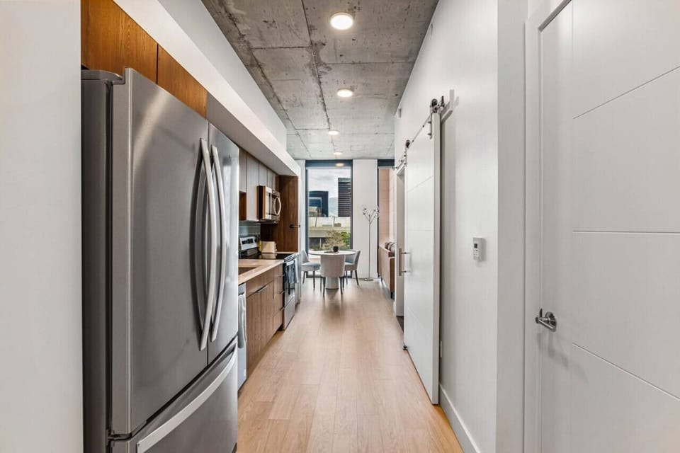 View of kitchen and cozy living room.