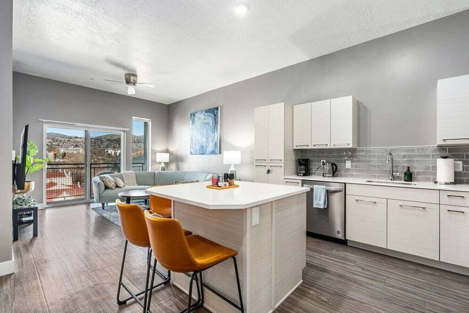 Open plan kitchen/living room with large picture windows and  amazing views