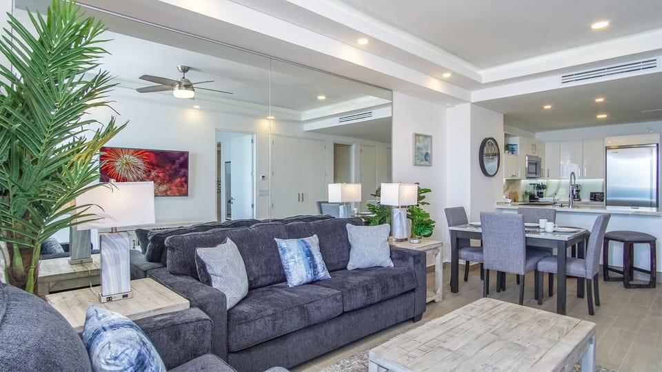 Mirrored living groom and large sofa make this space inviting