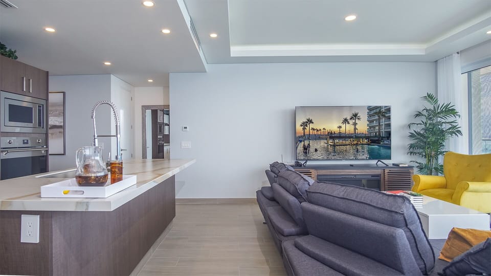 Roomy living area is open, with a large counter available at the kitchen island.