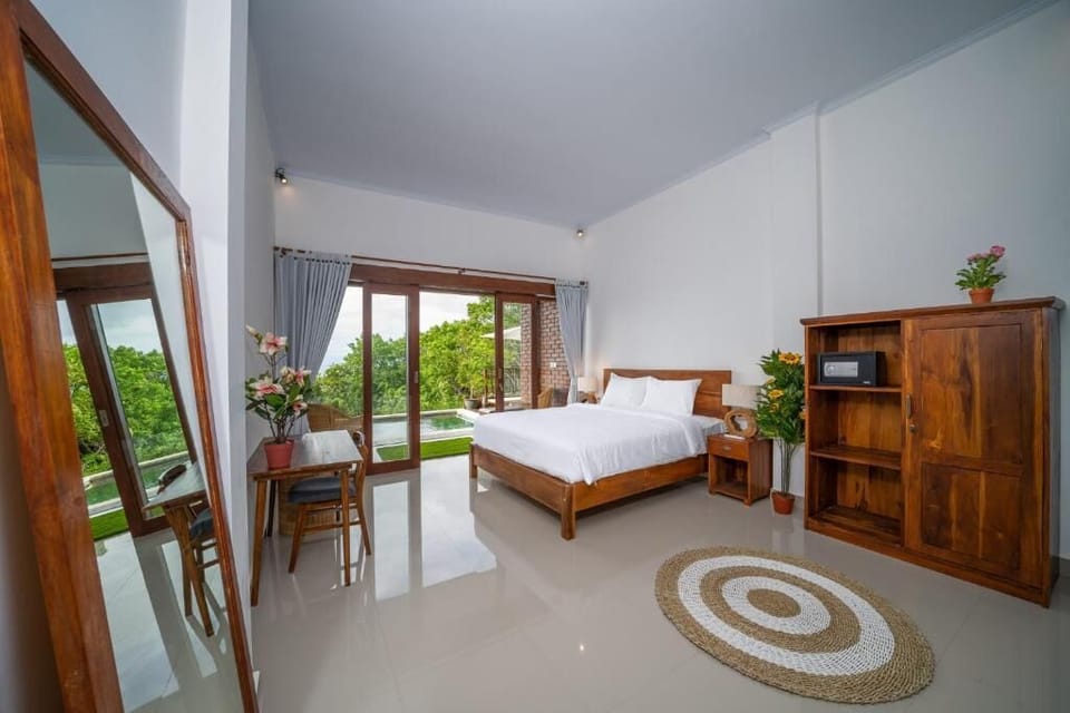 Deluxe Room, 1 Bedroom, Pool View | 1 bedroom, minibar, desk, laptop workspace