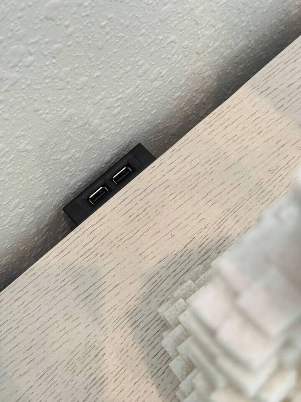 Each night stand and end table has USB charging ports. 