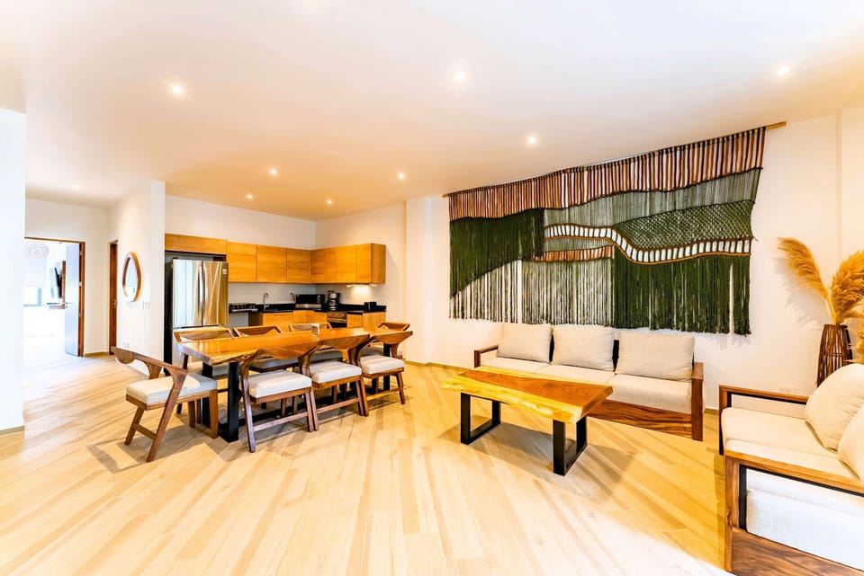 Living Room | Relaxing lounge with greenery, AC, and premium wooden accents.