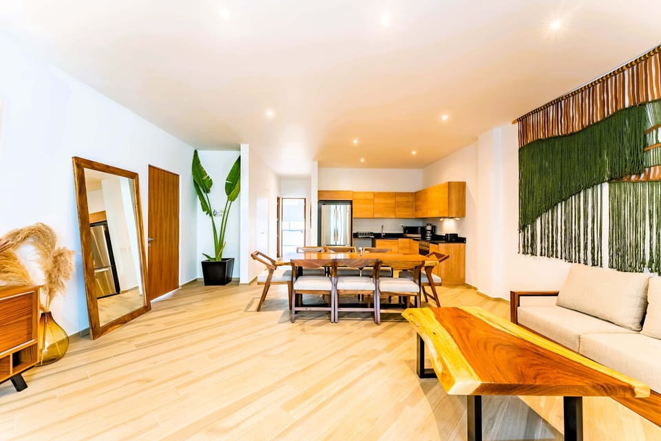 Living Room | Cozy seating area with Smart TV and elegant wood furnishings.
