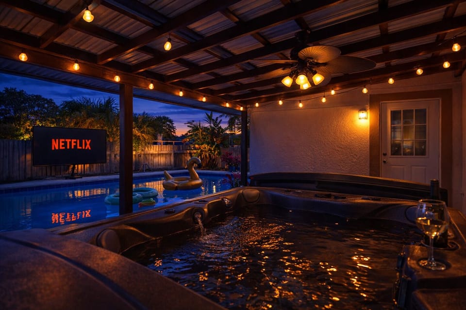 Unwind in the hot tub and watch your favorite TV shows/movies on the projector