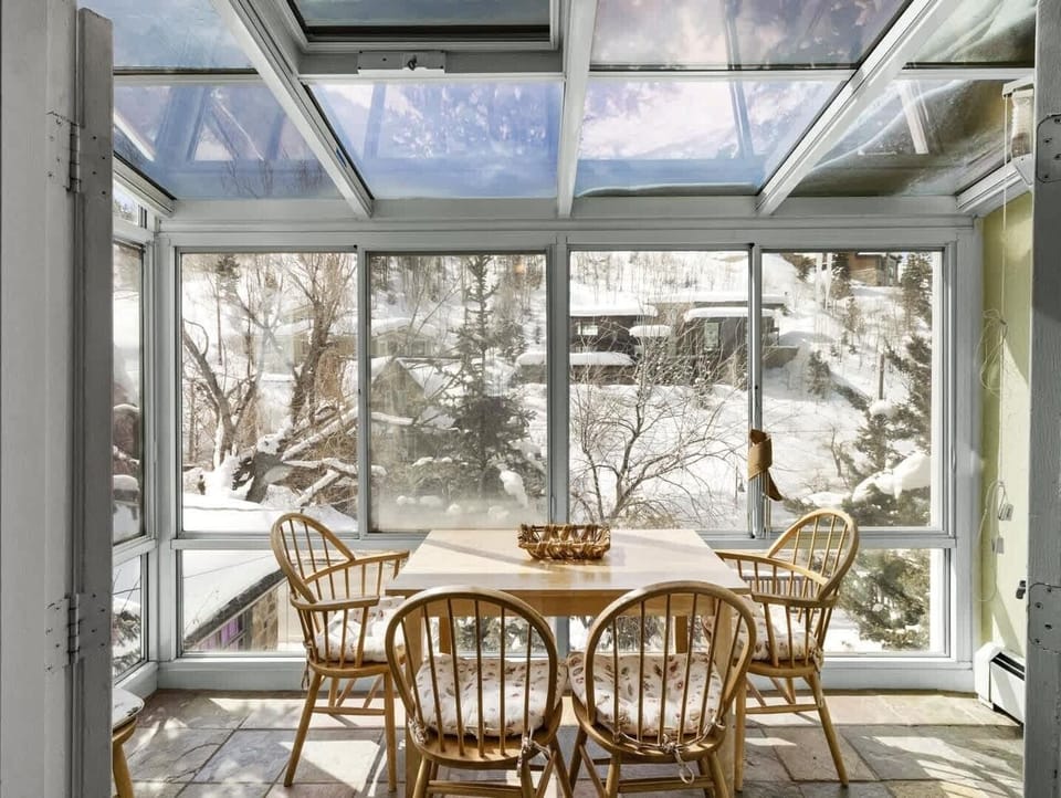 Enjoy the natural lighting and views from the glass-enclosed dining area. A meal out here with the snow trickling down is magical!