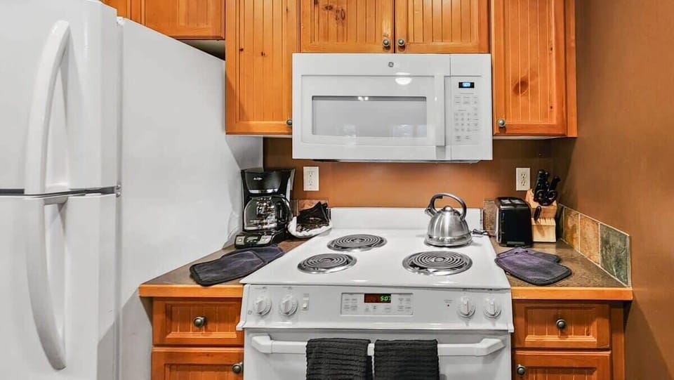 The well-laid-out kitchen includes a range of basic cookware perfect for those times you want to cook meals at home.
