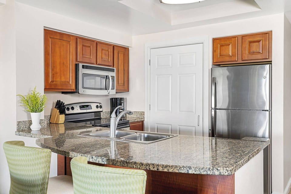 Full kitchen with stainless steel appliances