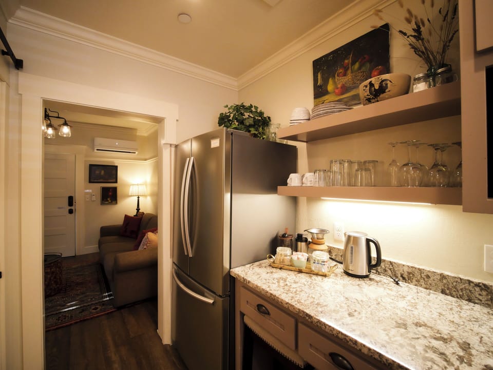 A fully equipped kitchen with granite countertops and thoughtful touches.