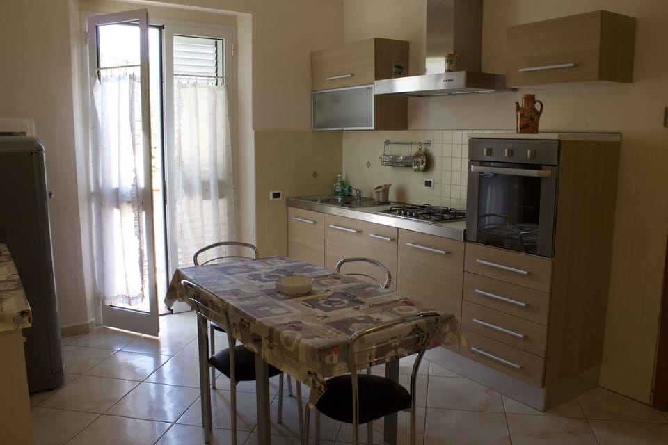 Panoramic Condo | Private kitchen | Full-size fridge, oven, stovetop, dishwasher