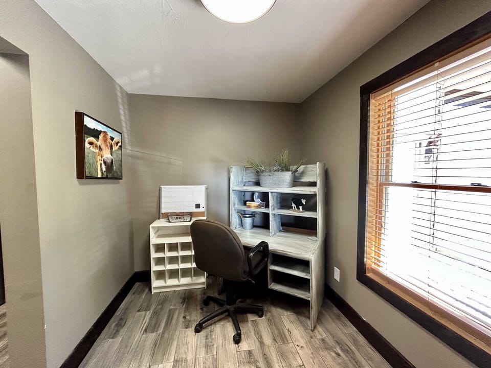 Office room with work desk .