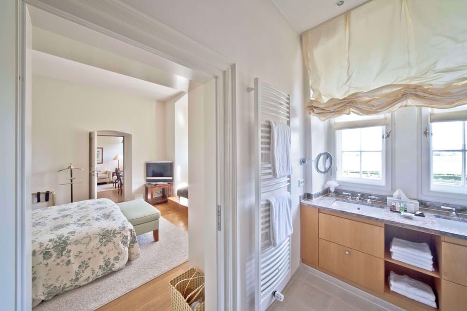Suite, 1 Double Bed | Bathroom | Hair dryer, bathrobes, slippers, towels