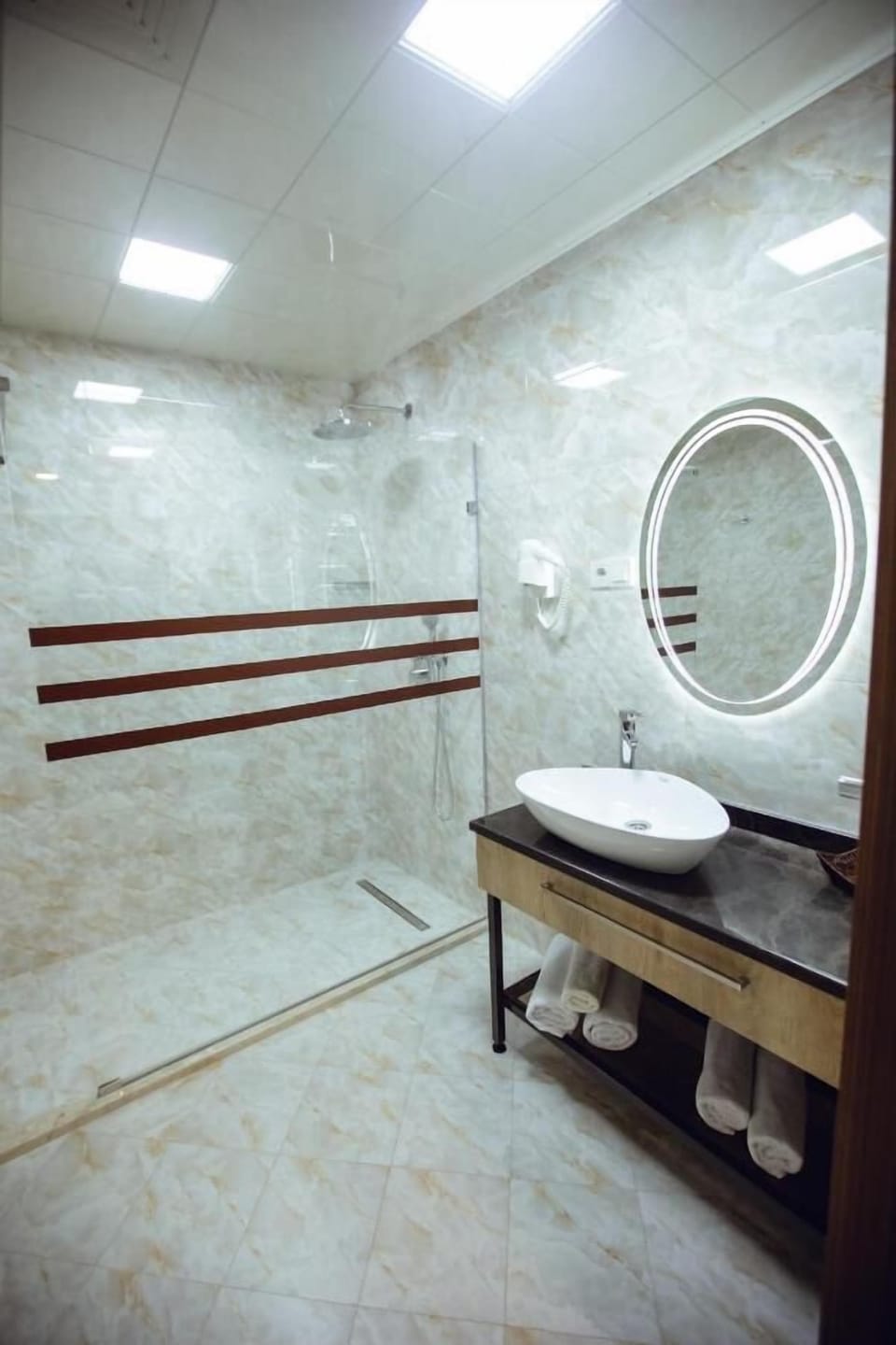 Shower, free toiletries, slippers, towels