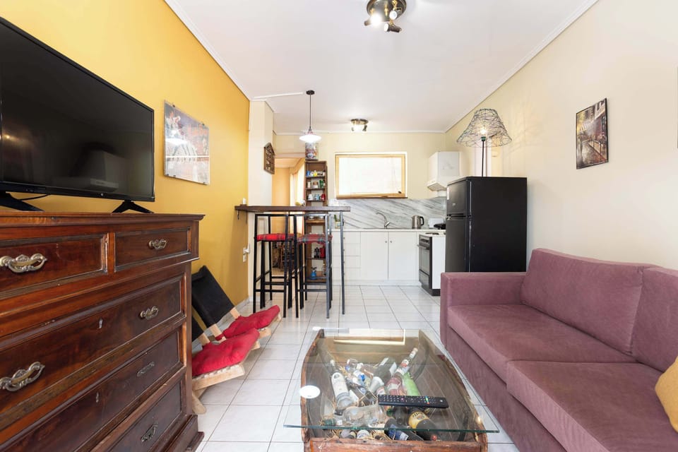 Bright Lounge Area with Sofa, Coffee Table, and Natural Light
Enjoy casual comfort with large windows and a relaxed atmosphere.

