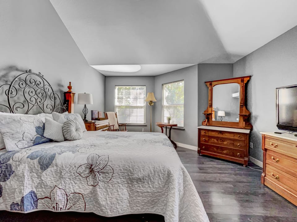 Master bedroom is equipped with a comfy queen bed and space for privacy.