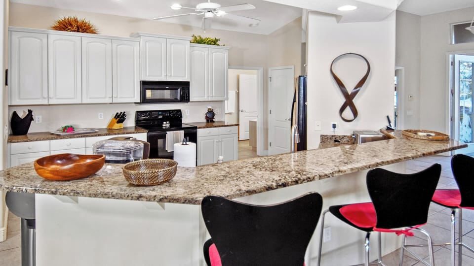 The fully equipped white kitchen leaves nothing to be desired