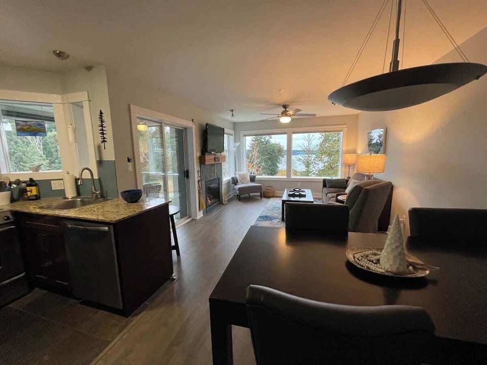 Living room with bay view and gas fireplace