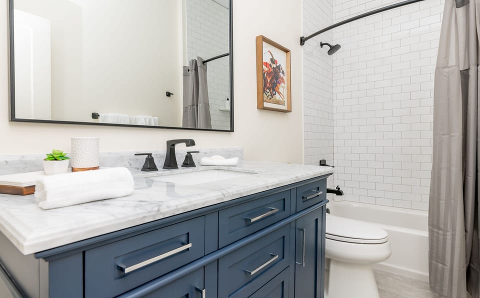 Angel's Share full bath with large vanity and shower/tub