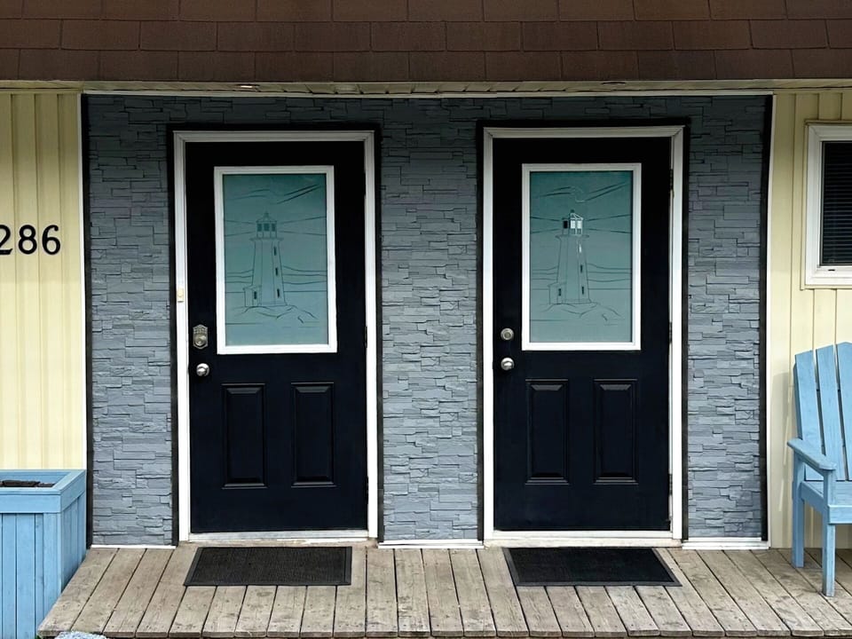 Front entrance with marine theme. The Port suite door is on the left.