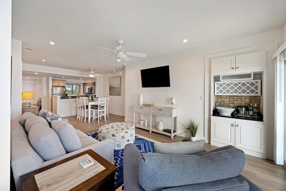 Open concept living room with flat screen TV