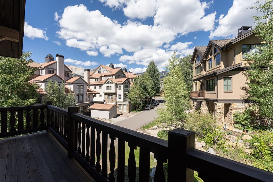 Private deck off the main living and dining area with beautiful surrounding views.