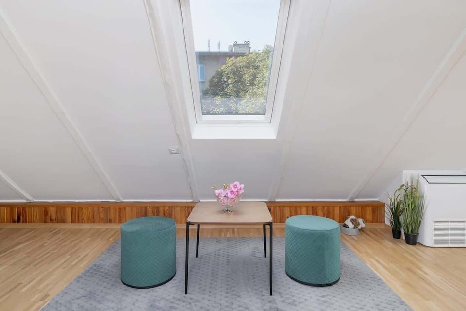 The living room's sleek design is both functional and aesthetically pleasing.