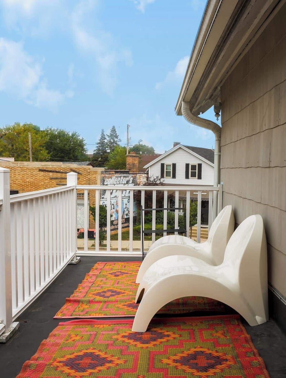 Smaller deck with seating in the front of the home, which overlooks the main strip on KK ave.