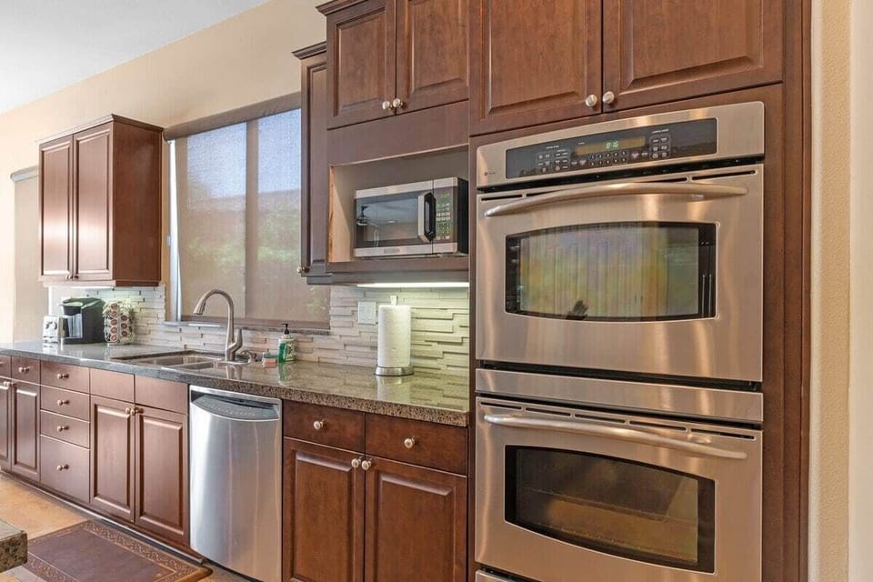 Stainless steel double ovens stacked high.